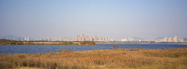 istock Autumn Scene by the City Lake 2255505891