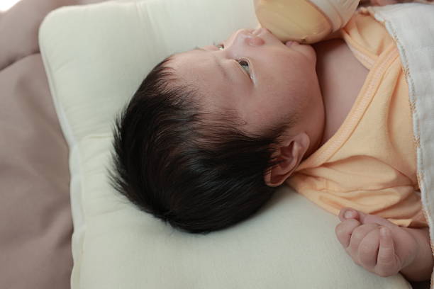 Newborn baby boy sleeping on the bed, little baby