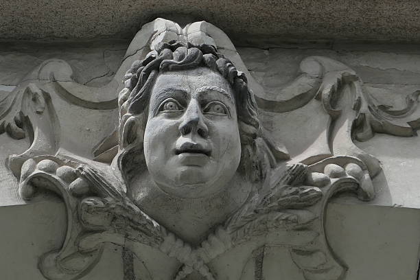 Mascarons, sculpted faces from the 18th-19th centuries adorning the facades of buildings in the city center of Nantes, Loire-Atlantique