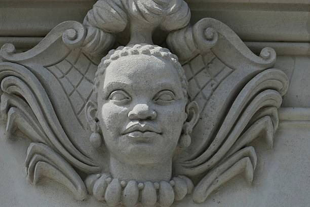 Mascarons, sculpted faces from the 18th-19th centuries adorning the facades of buildings in the city center of Nantes, Loire-Atlantique