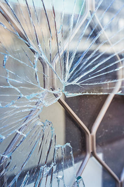 istock Crime prevention and vandalism concept. Broken display window of a shop. 2255509436