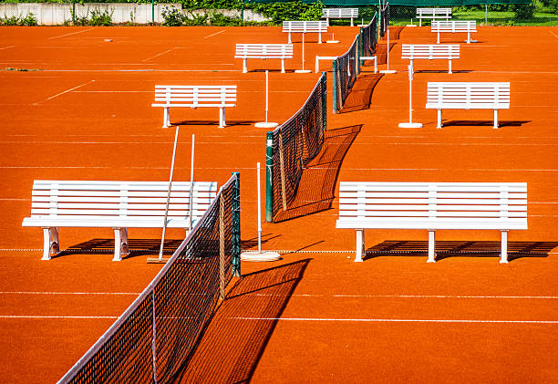 clay tennis courts and fence