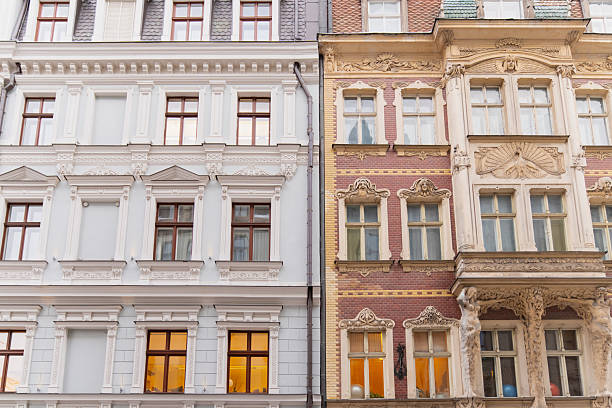 Historic classical architecture in Riga featuring richly decorated apartment house facades detailed window frames and preserved ornamental elements in urban streetscape
