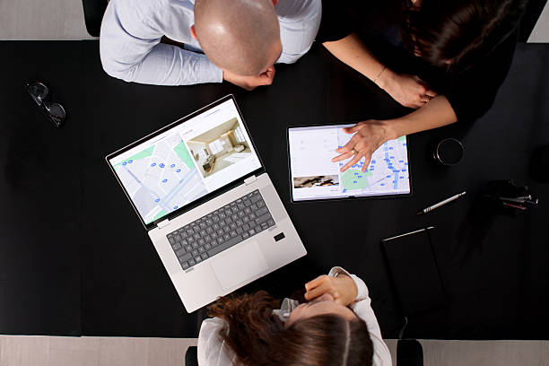 istock Young Couple Consults With Real Estate Agent 2255527405