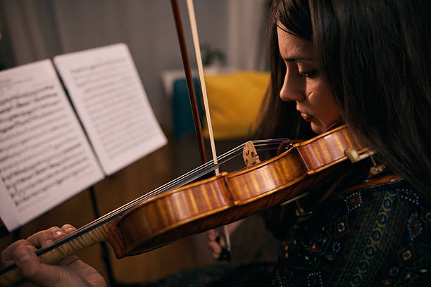 istock A Woman Concentrates on Playing the Violin 2255529516