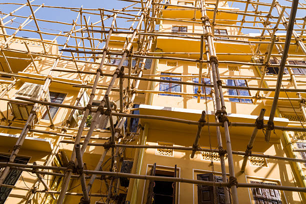 Bamboo scaffolding in front of window of new home under construction   in residential district of Bangkok Ladprao