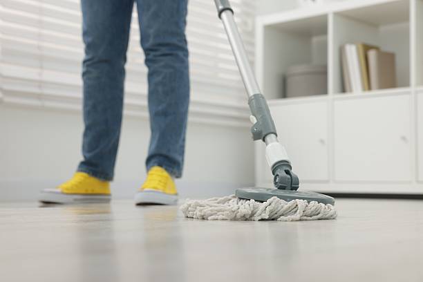 istock Woman cleaning floor with string mop indoors, closeup 2255535818