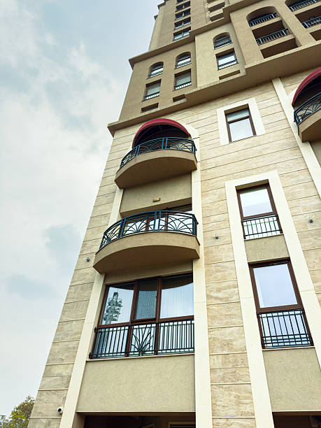 istock Building with multiple balconies and large windows in a residential area seen from below during daytime 2255537510