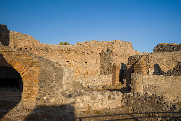 istock Golden light on ancient masonry in Pompeii quarters 2255539934