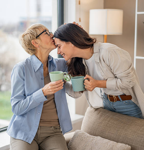 istock Mother daughter bonding with coffee at home 2255542846
