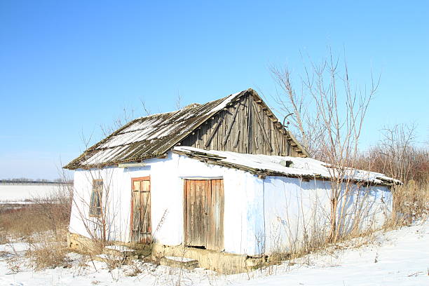 A house in the snow. Outdoor. Sky. Building. House
