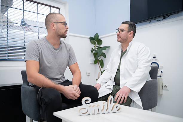istock Dentist and patient in the waiting room. 2255545025