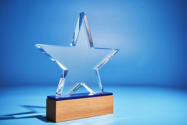istock crystal star shape trophy against blue background 2255545531