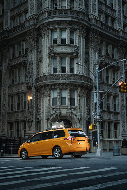Alwyn Court apartment building in New York City with a taxi stopped in front