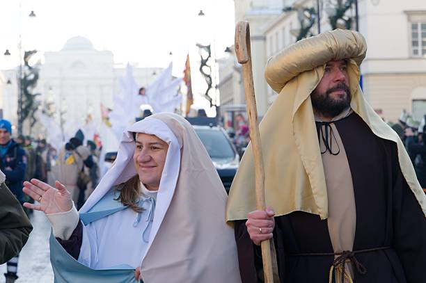 Nativity characters Mary and Joseph take part in the Three Kings Parade in winter Warsaw.