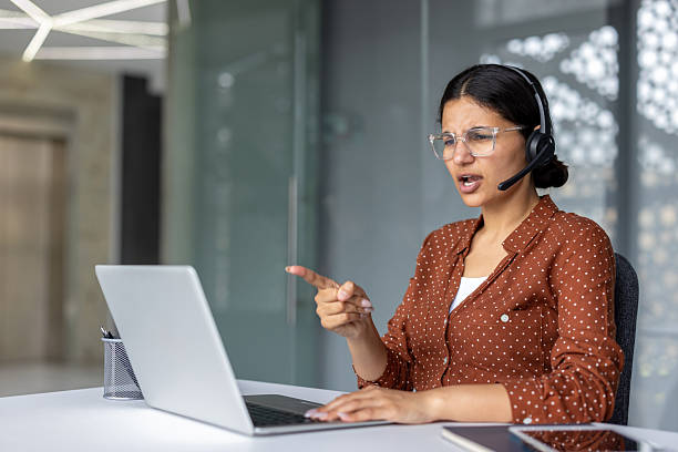 istock Woman experiencing work stress, frustration, and yelling during online service 2255554341