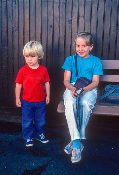 Durango CO - Bother & Sister on Bench at Station - 1990. Scanned from Kodachrome 64 slide.