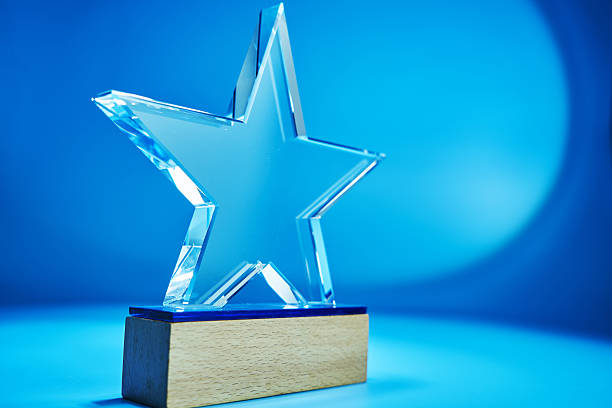istock star shaped crystal trophy against blue background 2255559365