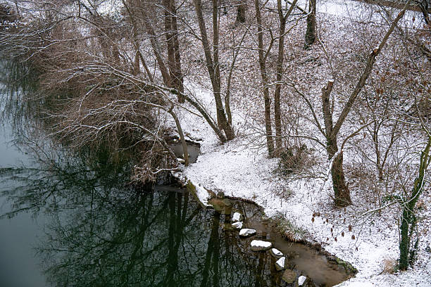 Idyllic snow-covered riverside landscape