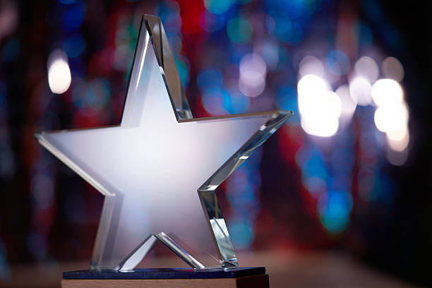 istock crystal star shape trophy against bokeh light as background 2255570230
