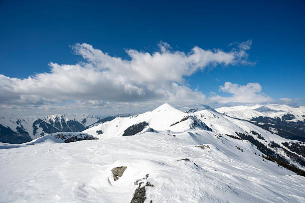 View on the snowy Tiroler Alps in Austria during a beautiful winter day. The mountains around the Linker Fernerkogel are seen from the Tiefenbachkogel ski slopes of the Sölden Ski Area near the Ötztal.
