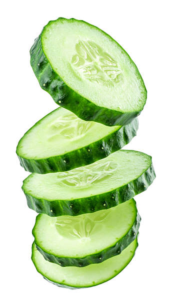 Fresh cucumber slices falling with transparent background