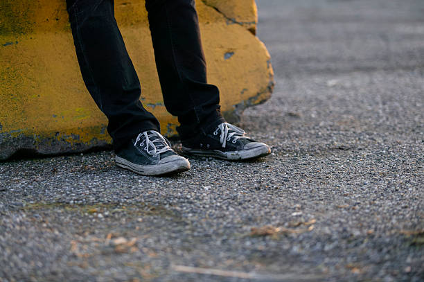 Cropped Image Of Man Wearing Purple Canvas Shoe