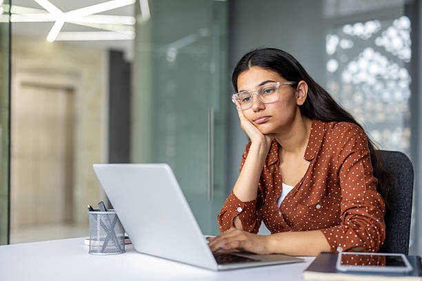 istock Young woman suffering from burnout and workplace fatigue 2255588317