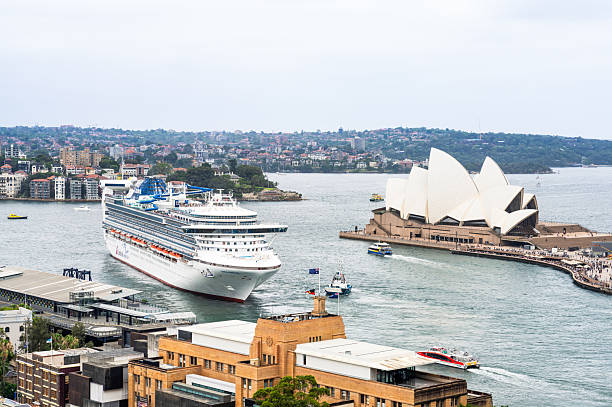 Sydney, Australia - A large Carnival  Cruise Line ship in Sydney Harbour, close to the Sydney Opera House.