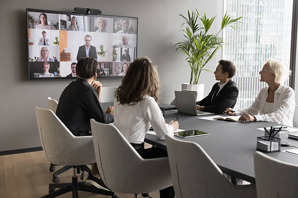 istock Staff members engaged in virtual meeting with partners using videocall 2255592001