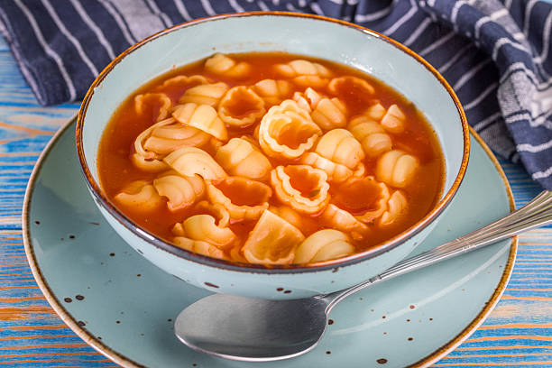 Fresh tomato soup with conchigliette in a bowl.