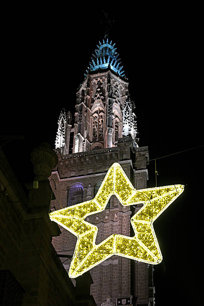 Cathedral tower and Christmas star in Toledo night