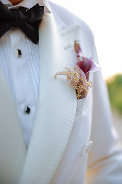 A groom preparing to marry the love of his life. Close up of businessman wearing cufflinks. Elegant young fashion business man wearing suit