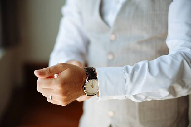 a handsome man with a beard eats borscht in a plate at a table in a cafe and a watch on his hand. High quality photo