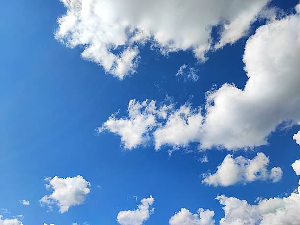 Beautiful blue sky with small fluffy clouds in the sky