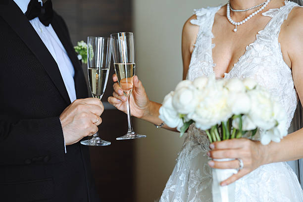 istock Bride And Groom Toasting Champagne Flutes 2255602113