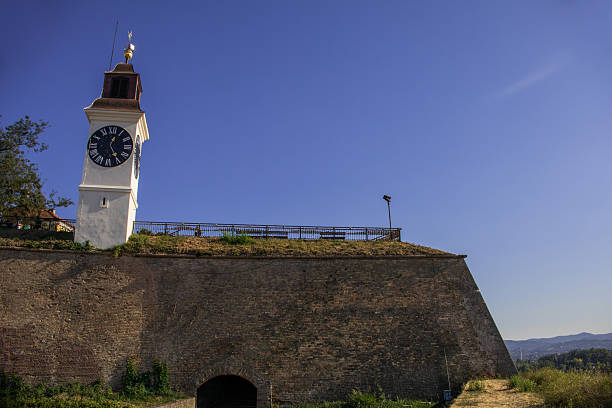The clock tower in Novi Sad is a significant visual of the city and the Petrovaradin Fortress. The big hand on the clock shows the hours and the small ones shows minutes, so the sailors on the river Danube could see what time it was from a great distance. It is nicknamed the Drunk Clock due to the backwards hour and minute hands and a timing mechanism that fluctuates with the temperature.