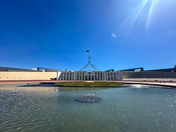 Canberra, Australia - 9 Sep 2024: Modern city architecture of facade of the Federal Parliament house public service in Canberra, Australia.