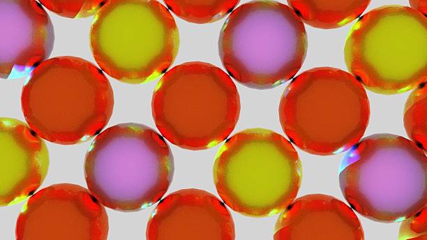 A set of spheres arranged in a grid pattern with spaces between them on a white background; the textures are metallic orange, metallic yellow, and metallic pink.