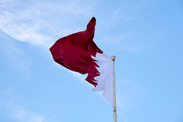 istock Qatar Flag flying high in the wind. Qatari Falg 2255635860