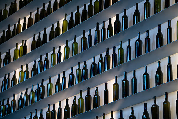 white arrow of stacked bottles with black stacked bottles background