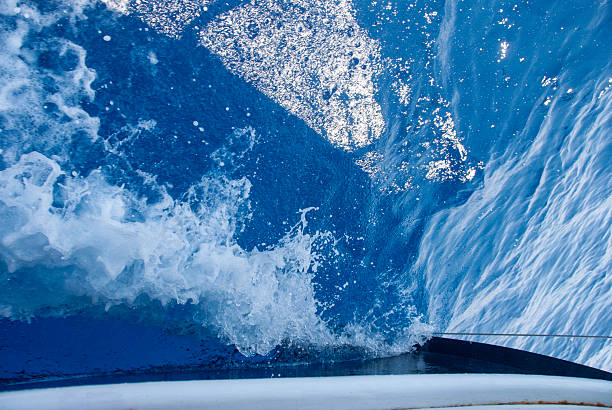 Foaming water from the side of a yacht