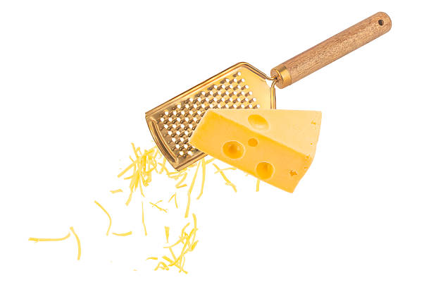 Metal food grater on a wood background