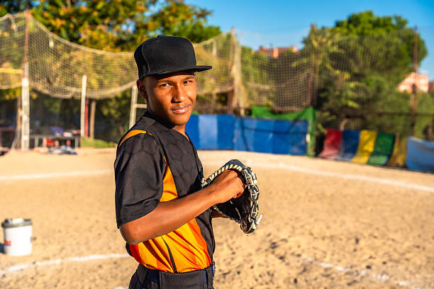 Baseball players practicing pitching on the baseball field.