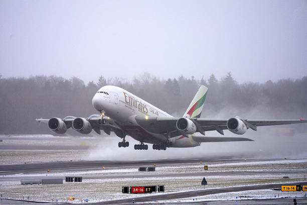 Emirates passenger airplane Airbus A380-800 registration A6-EUD taking off from Swiss Zürich Airport on a snowy winter day. Photo taken January 10th, 2026, Zurich, Switzerland.
