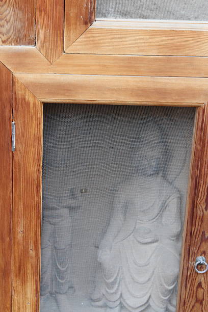 Buddha and Bodhisattvas statues made in the Glorious Age of Tang Dynasty was carved in this shallow niche at Bingling Temple Grottoes in Yongjing County, Gansu Province