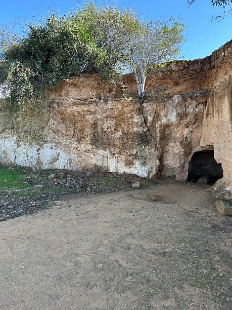 istock entrance to a cave in a stone cliff 2255648498