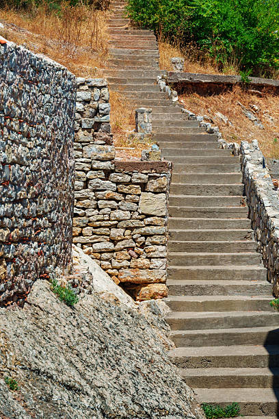 Old stone staircase on a steep hill in Petrovac Montenegro.
