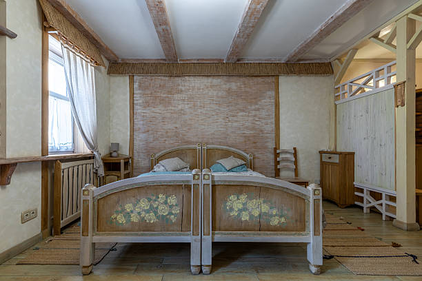 Suitcase with clothes and accessories on bedroom