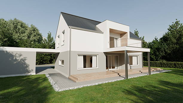 istock modern house stands in a green area with trees around. building features a deck in front and large windows. setting shows a sunny day with clear blue skies. 3d render 2255663047